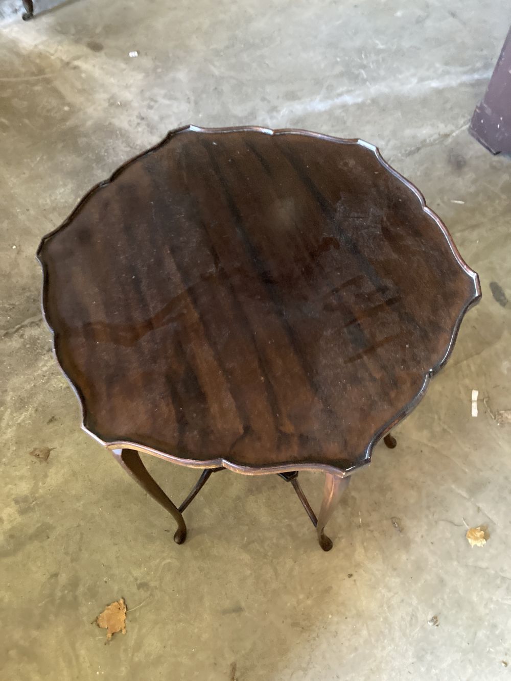 A late Victorian mahogany shaped circular topped two tier table, 67cm diameter, 72cm high